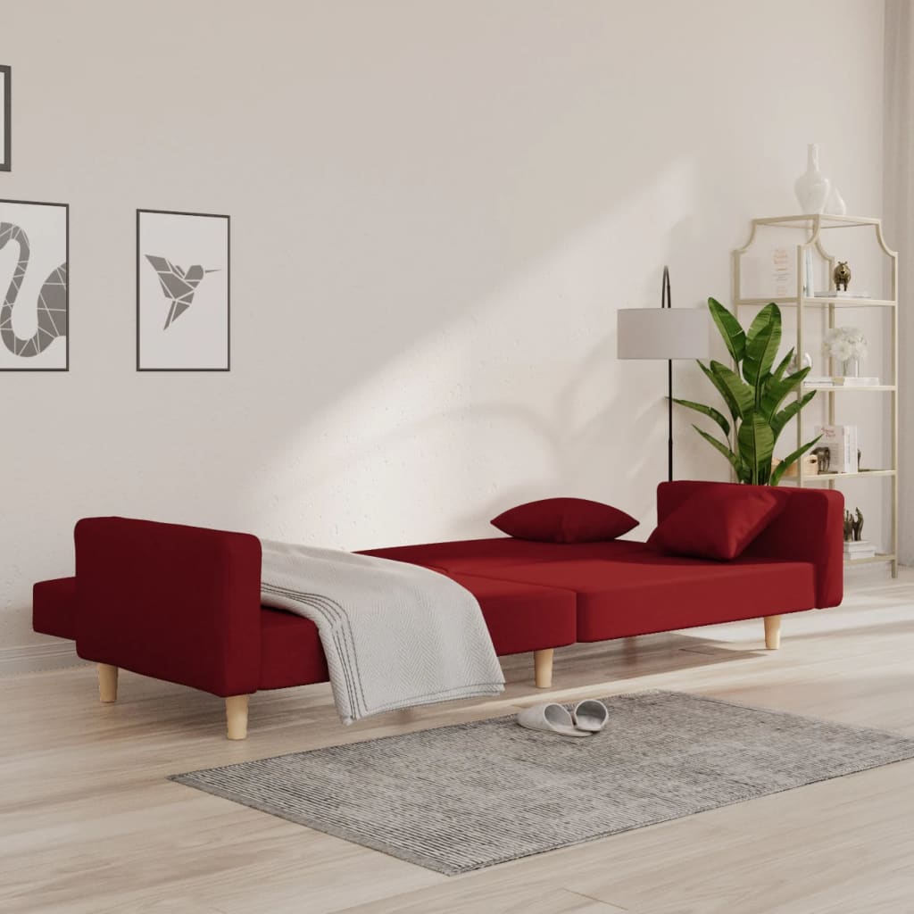 Kétszemélyes bordó szövet kanapéágy két párnával 3
